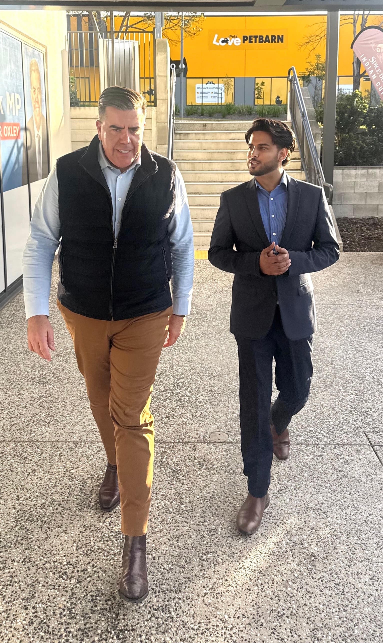 GP Singh walking and talking with the Hon Milton Dick MP